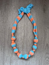 Load image into Gallery viewer, Dolly knot necklace (blue/orange stripe)
