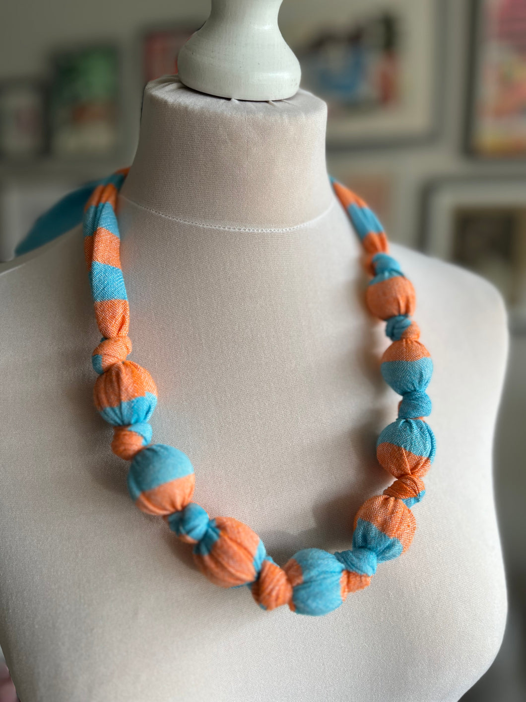 Dolly knot necklace (blue/orange stripe)